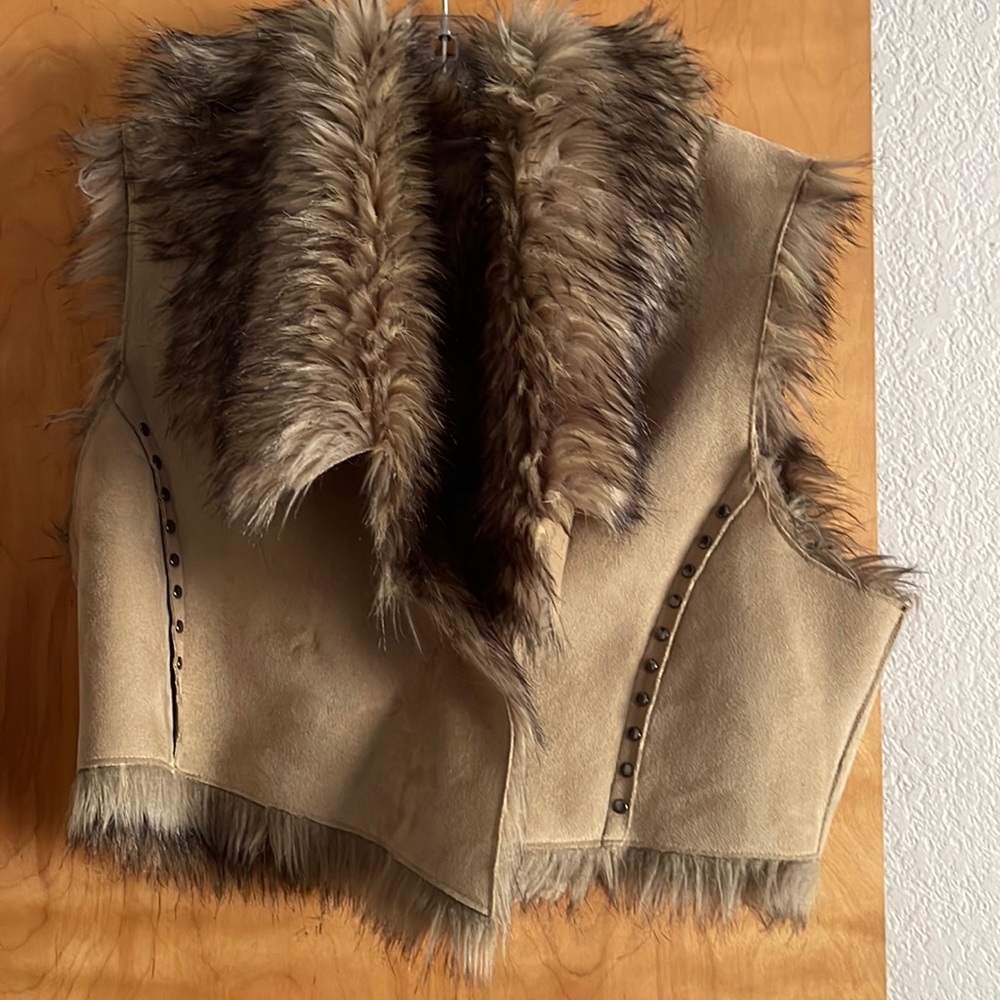 Fur vest with deal buttons along the back